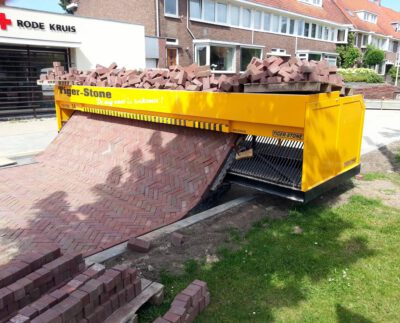 follow-the-self-made-road-incredible-machine-that-lays-out-a-carpet-of-bricks-removing-back-breaking-hard-work