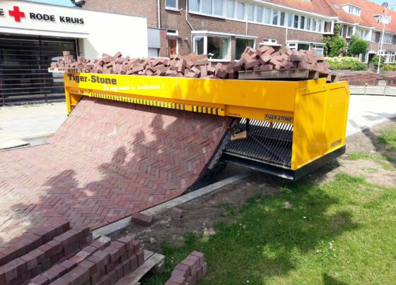 follow-the-self-made-road-incredible-machine-that-lays-out-a-carpet-of-bricks-removing-back-breaking-hard-work